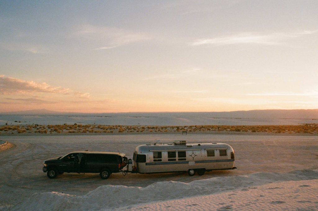 Havstad's travel trailer—her mobile hat shop—parked along the side of an open road.