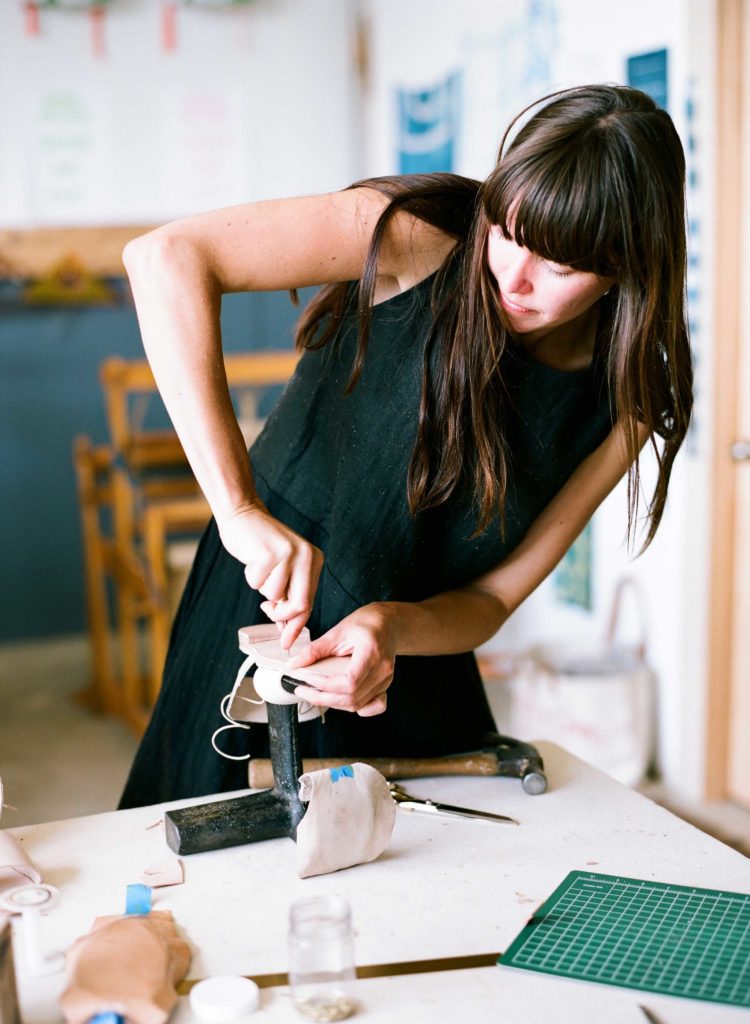 Rachel Corry—owner of Rachel Sees Snail Shoes—working on a shoe project.