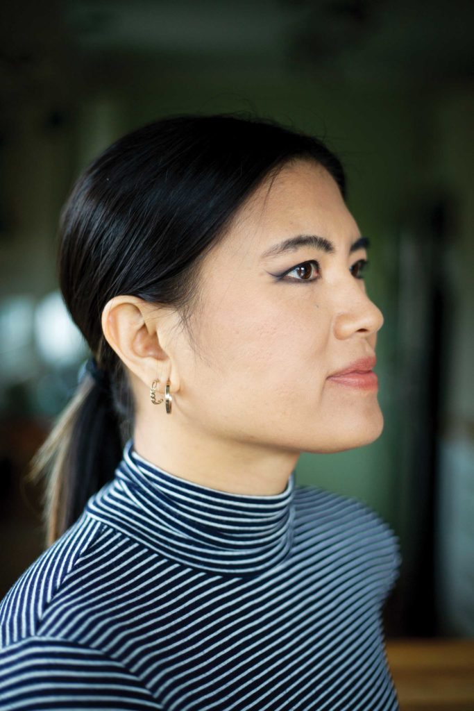 A sideview portrait of T Ngu—owner and designer of jewelry line Upper Metal Class.