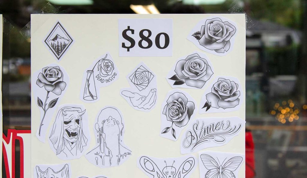 Various illustrations for tattoos on a window sign